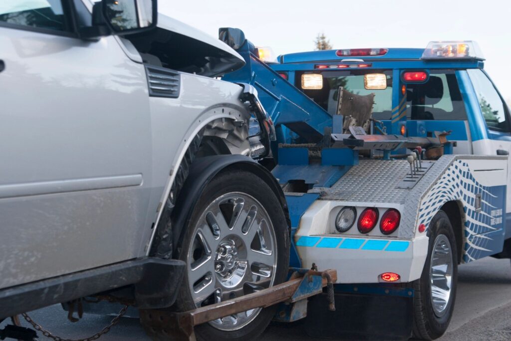 car being towed by towing company